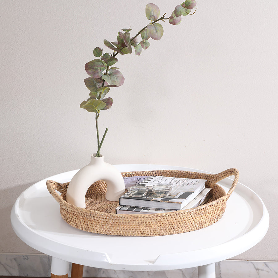 Woven rattan display tray, Oval wicker tray with handles, Decorative coffee table tray, Minimalist tabletop décor tray, Modern Boho rattan tray, Wicker tray for organizing essentials,
Stylish tray for center table setup.